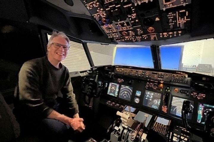 a man standing in front of a computer