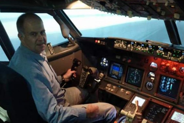 a man standing in front of a car