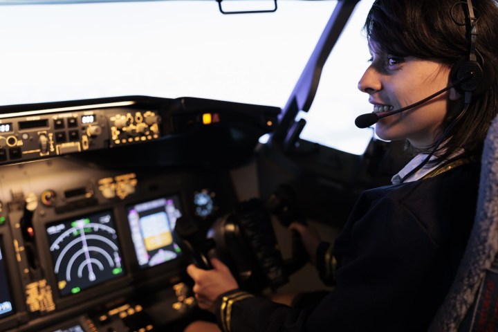 a person standing in front of a computer