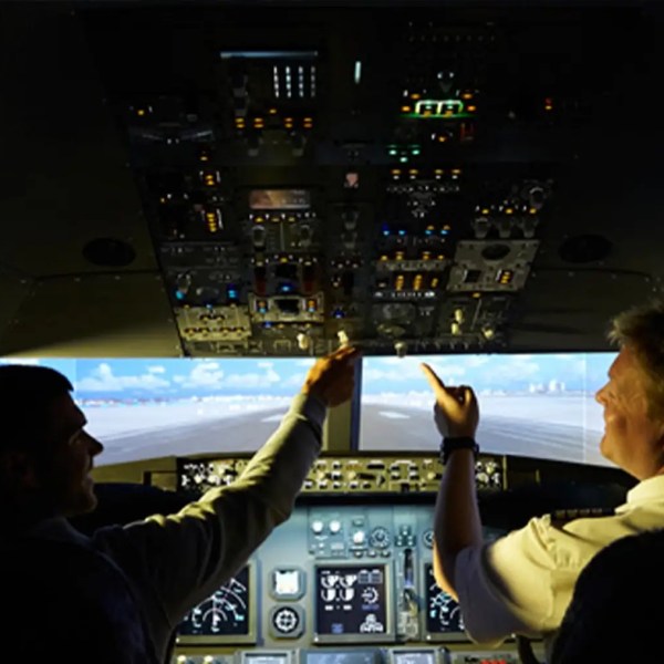 a man standing in front of a computer