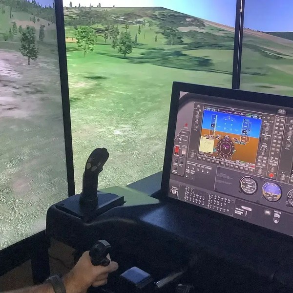 a man standing in front of a computer screen