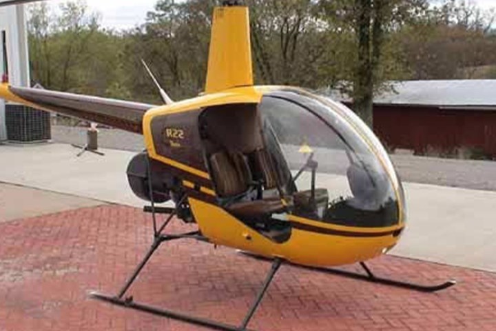 a small airplane is parked on the side of the road